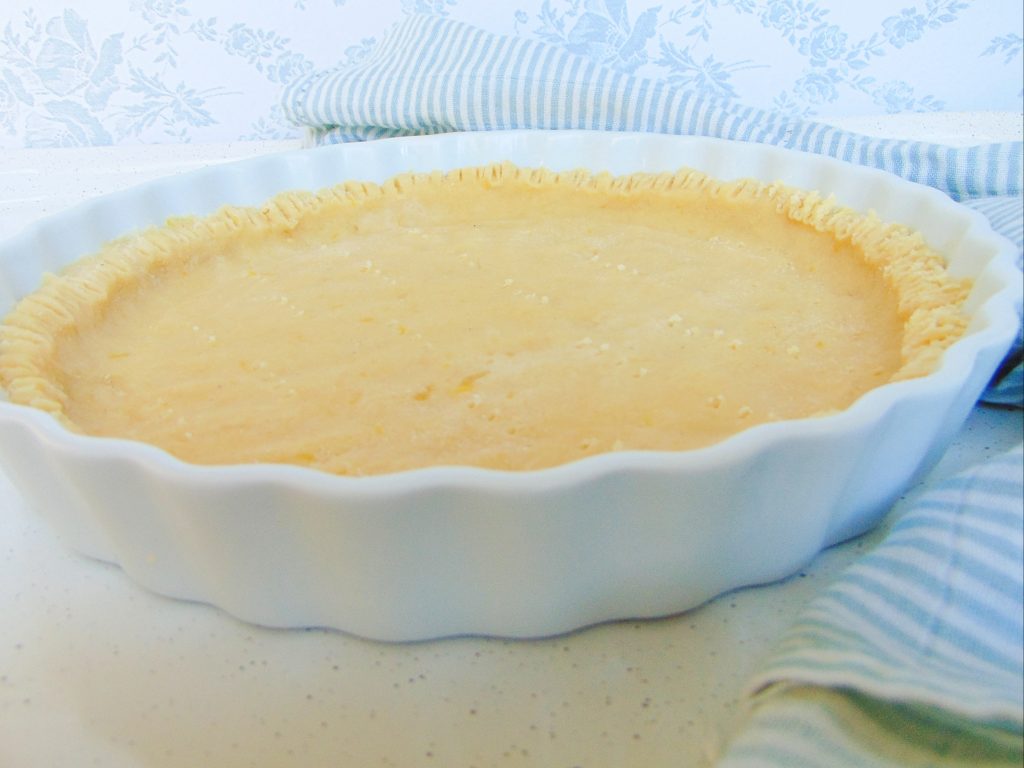 Coconut flour pie crust in ceramic dish