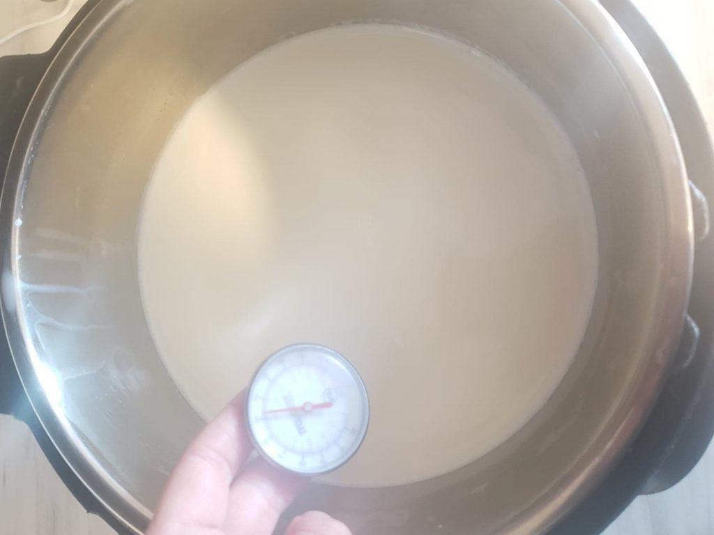 Milk warming in Instant Pot, checked temperature with meat thermometer to make bulgarian yogurt