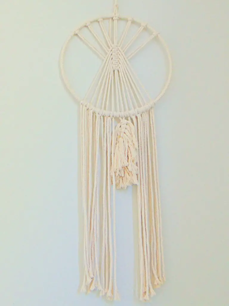 DIY round macrame hanging used as decor for a minimalist cute and cozy kid's bedroom