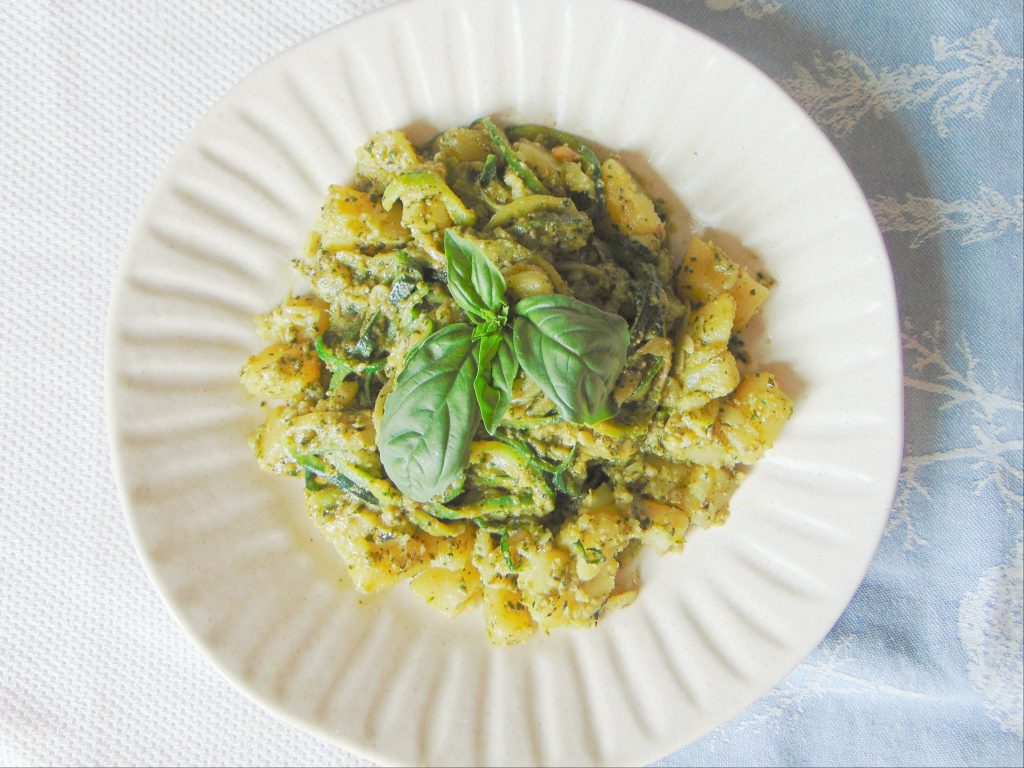 Zucchini Noodles with Homemade Pesto and Potatoes on white plate