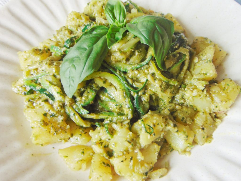 Zucchini Noodles with Homemade Pesto and Potatoes on white plate