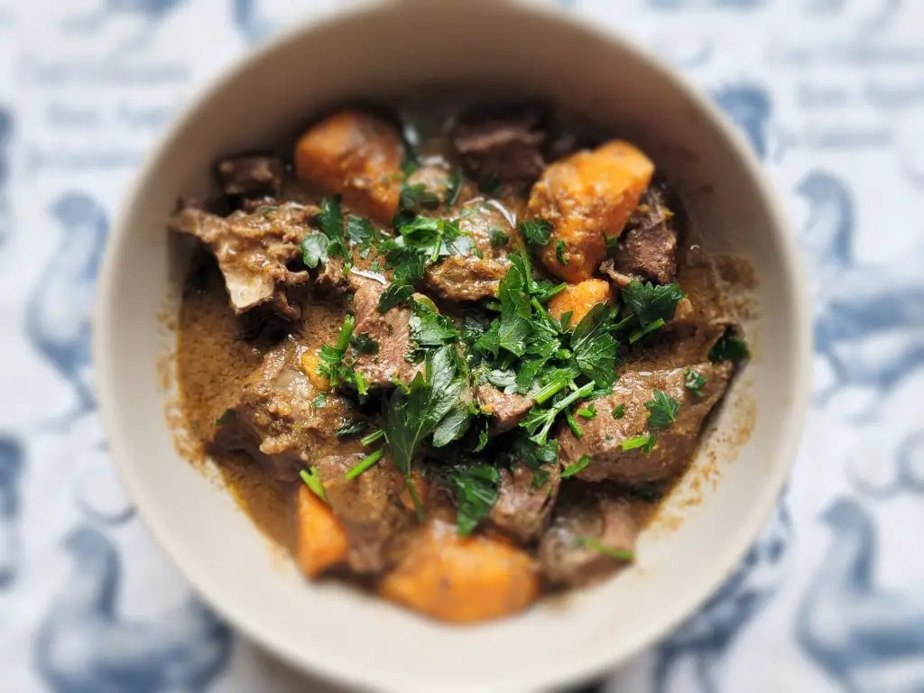 Slow-Cooked Nourishing Beef Heart Stew in the Instant Pot serving in a grey bowl