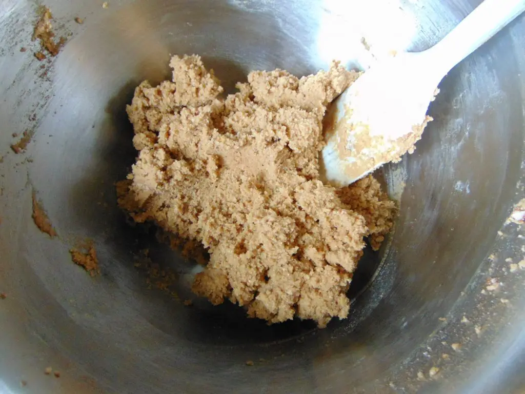 Making coconut flour gingerbread man cookie dough in a bowl