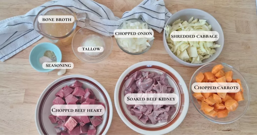 Displayed ingredients for beef heart and kidney stew on wooden surface. Ingredients are marked with names on image